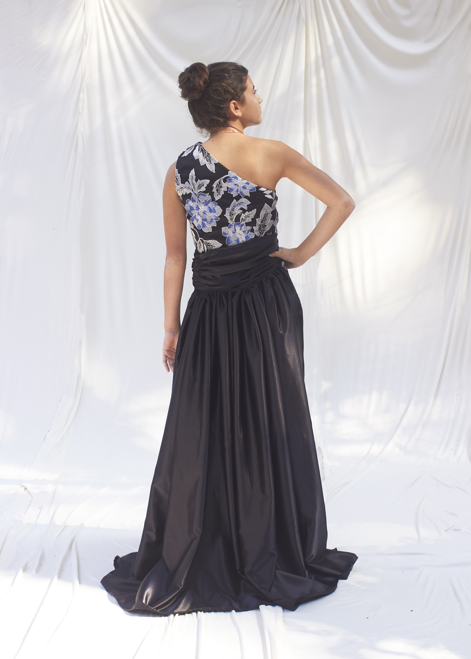 Back view of brocade gown and black train