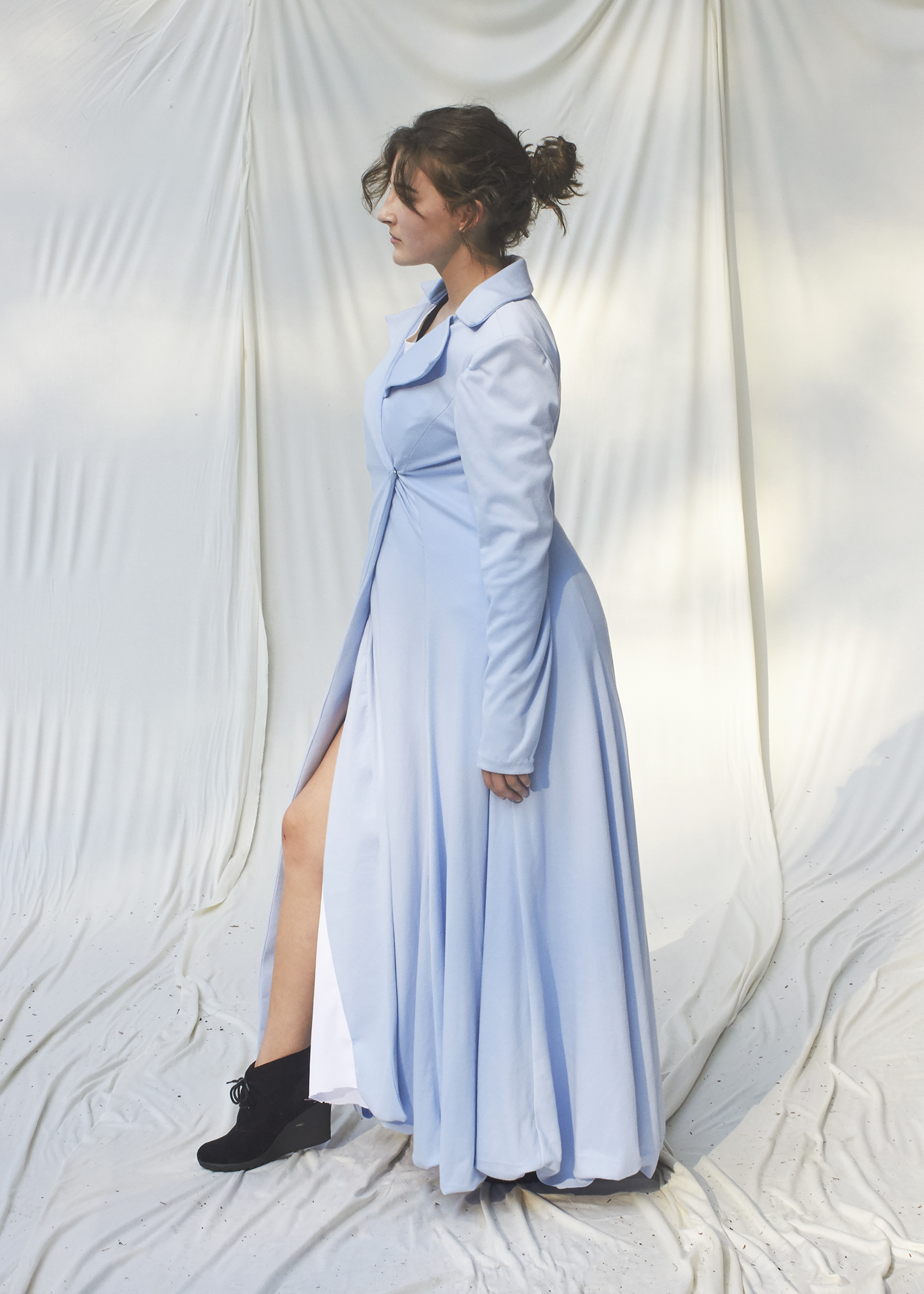 Side view of floor length sky blue coat 