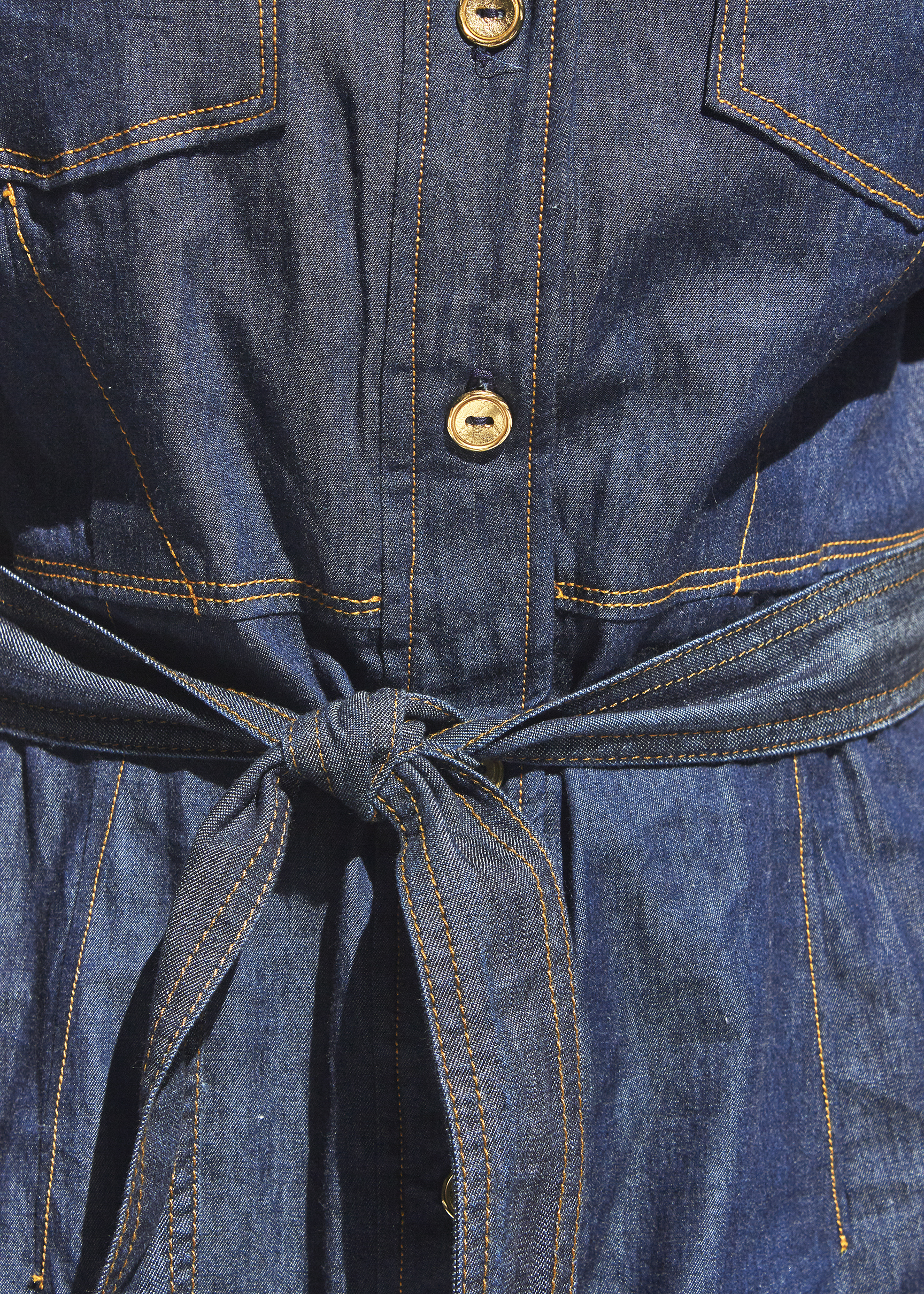 Photo of a buttoned up denim dress with tie