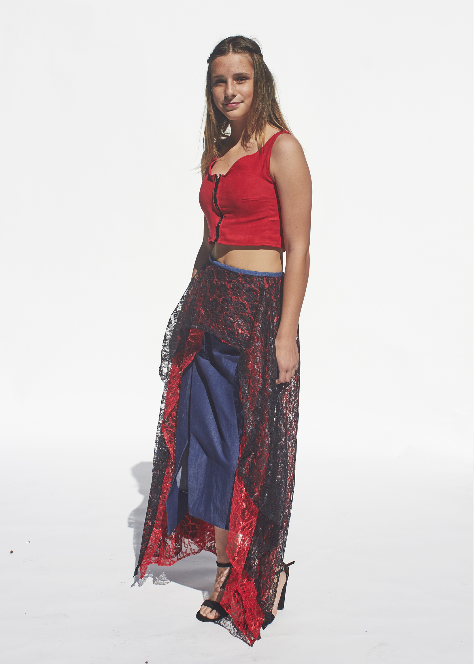 Photo of denim skirt with black and red denim overlay paired with a red top