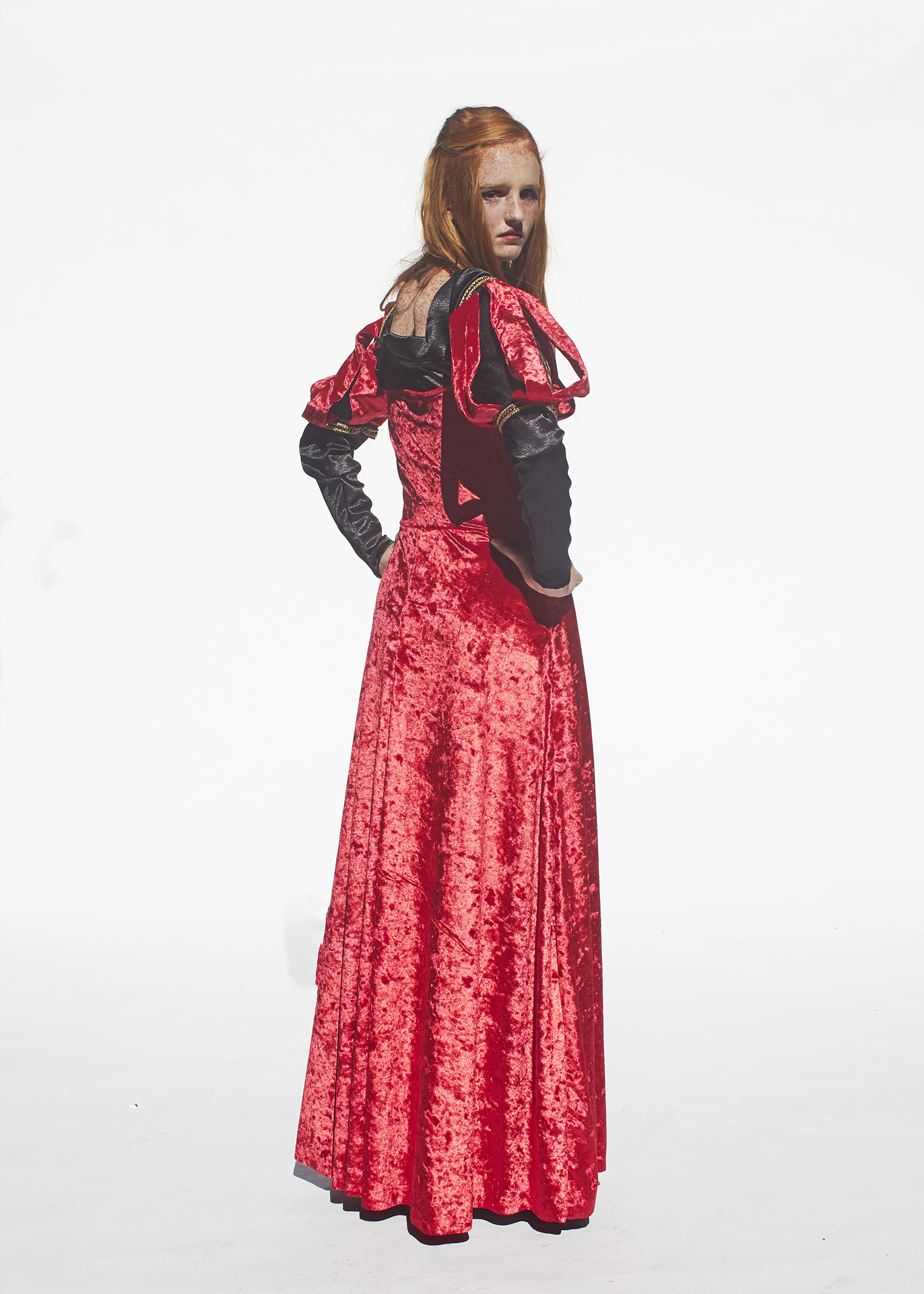 Back view of red velvet queen of hearts costume