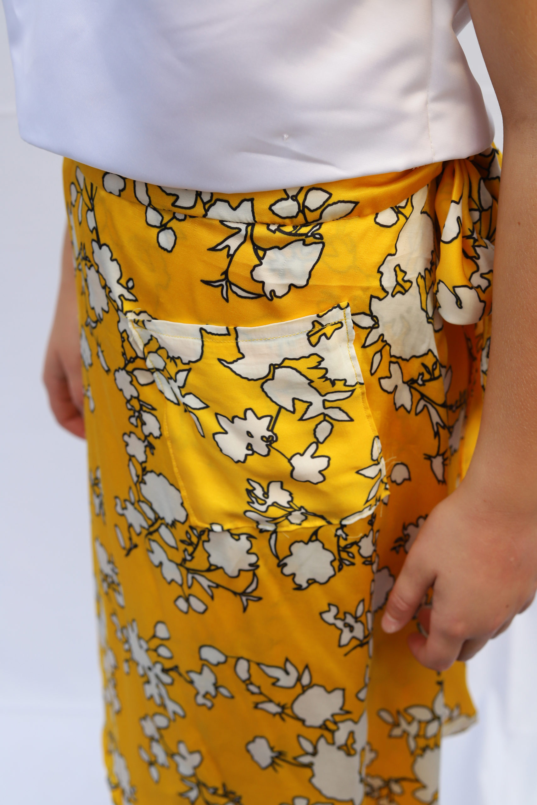 Detail shot of yellow floral skirt