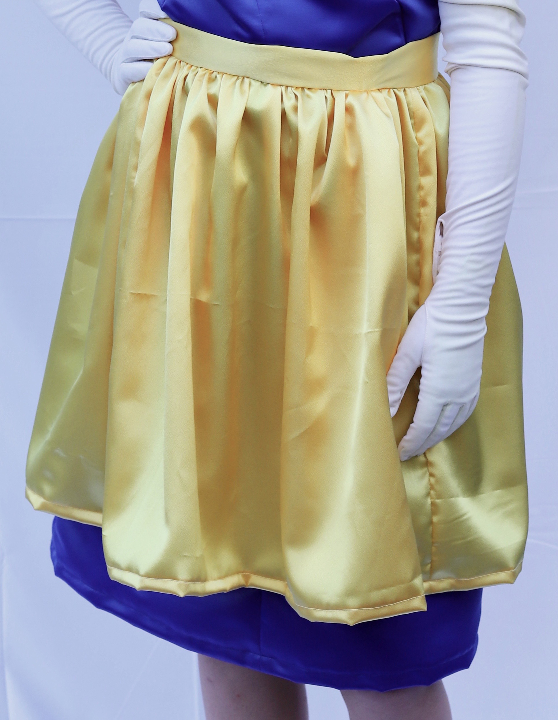 Close up photo of yellow satin apron