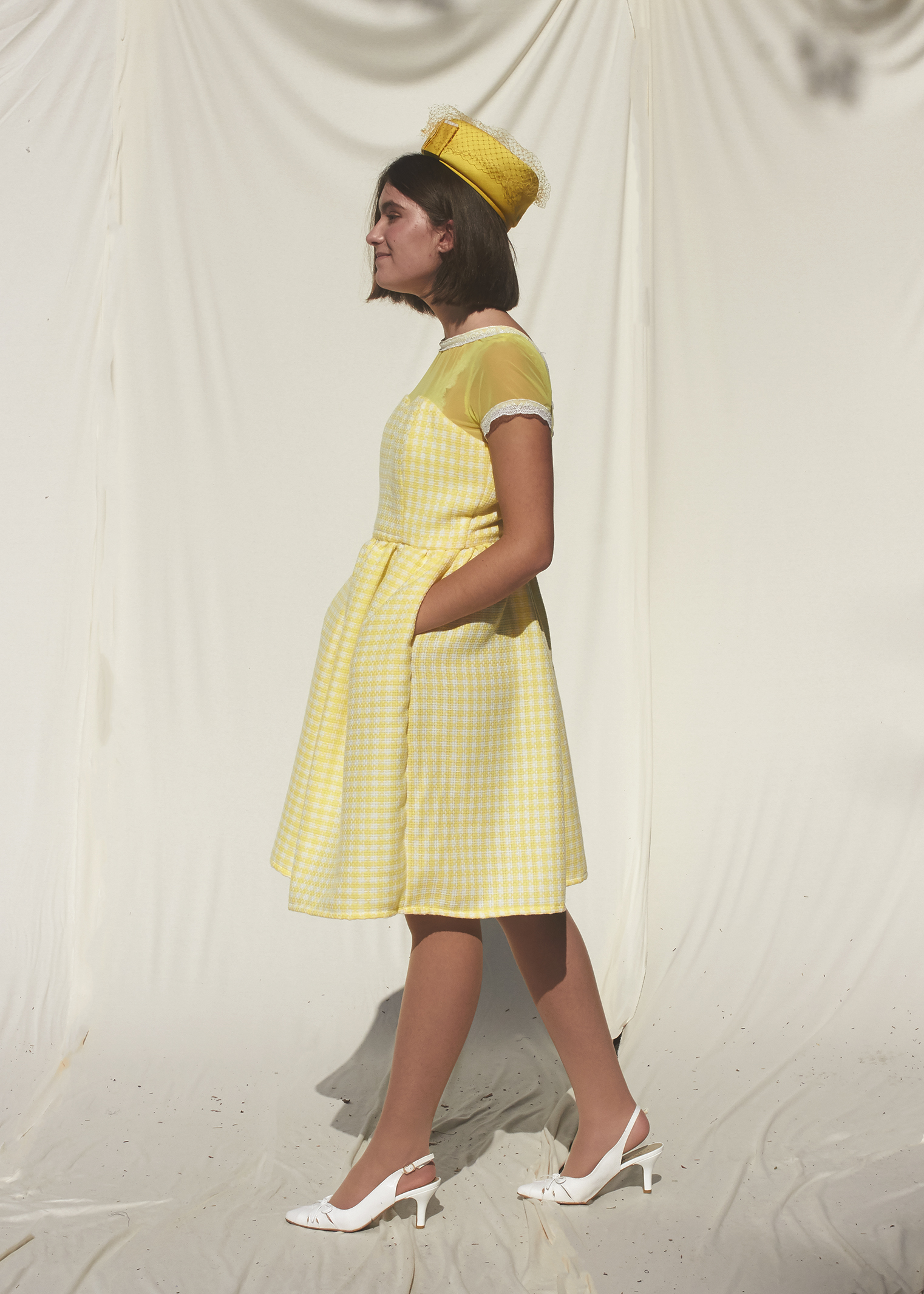 Side view of pastel yellow gingham dress