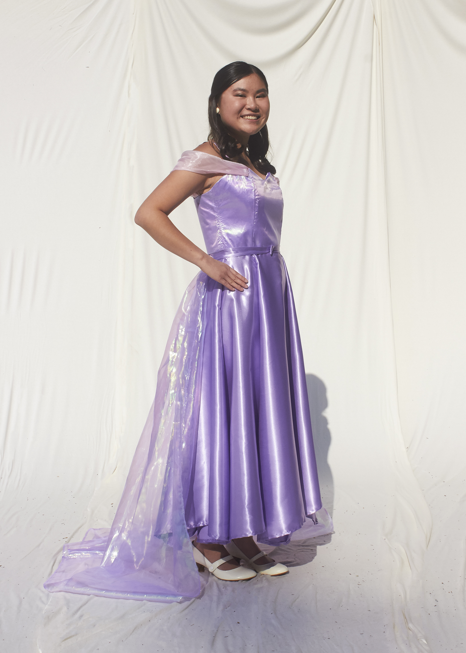 Side view of girl in lavender princess tea length gown