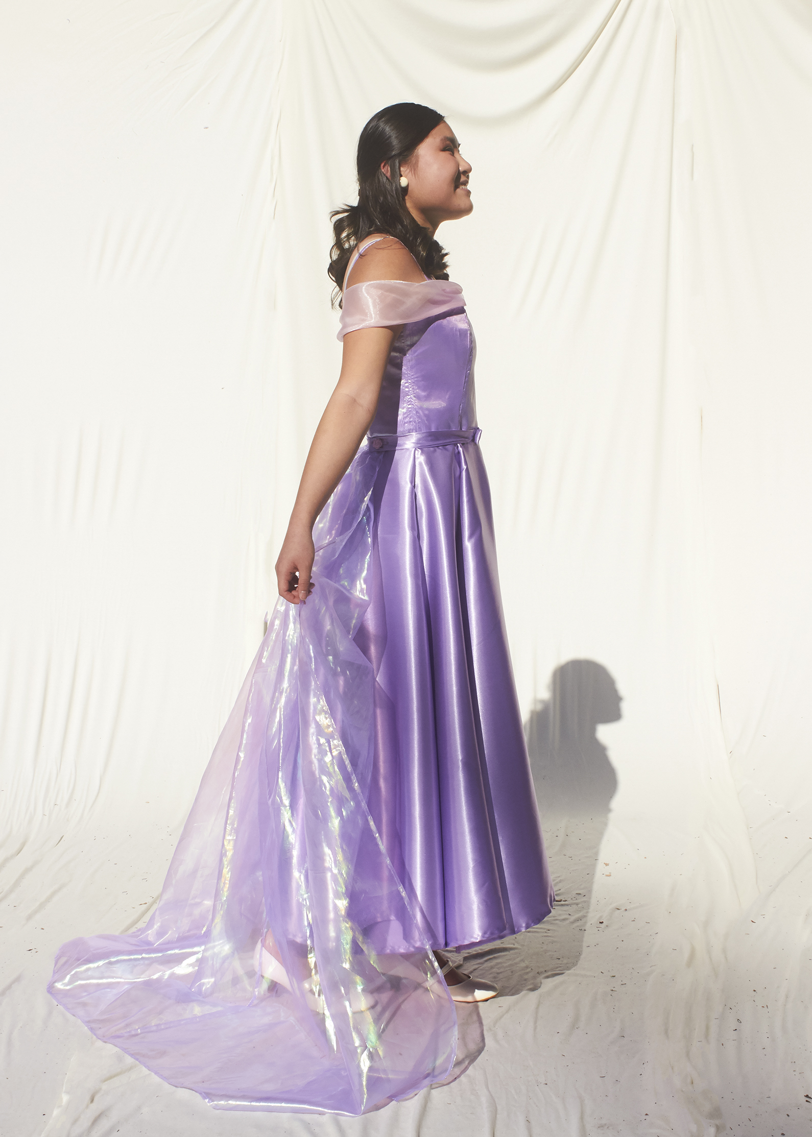 Side view of lavender tea length gown with 