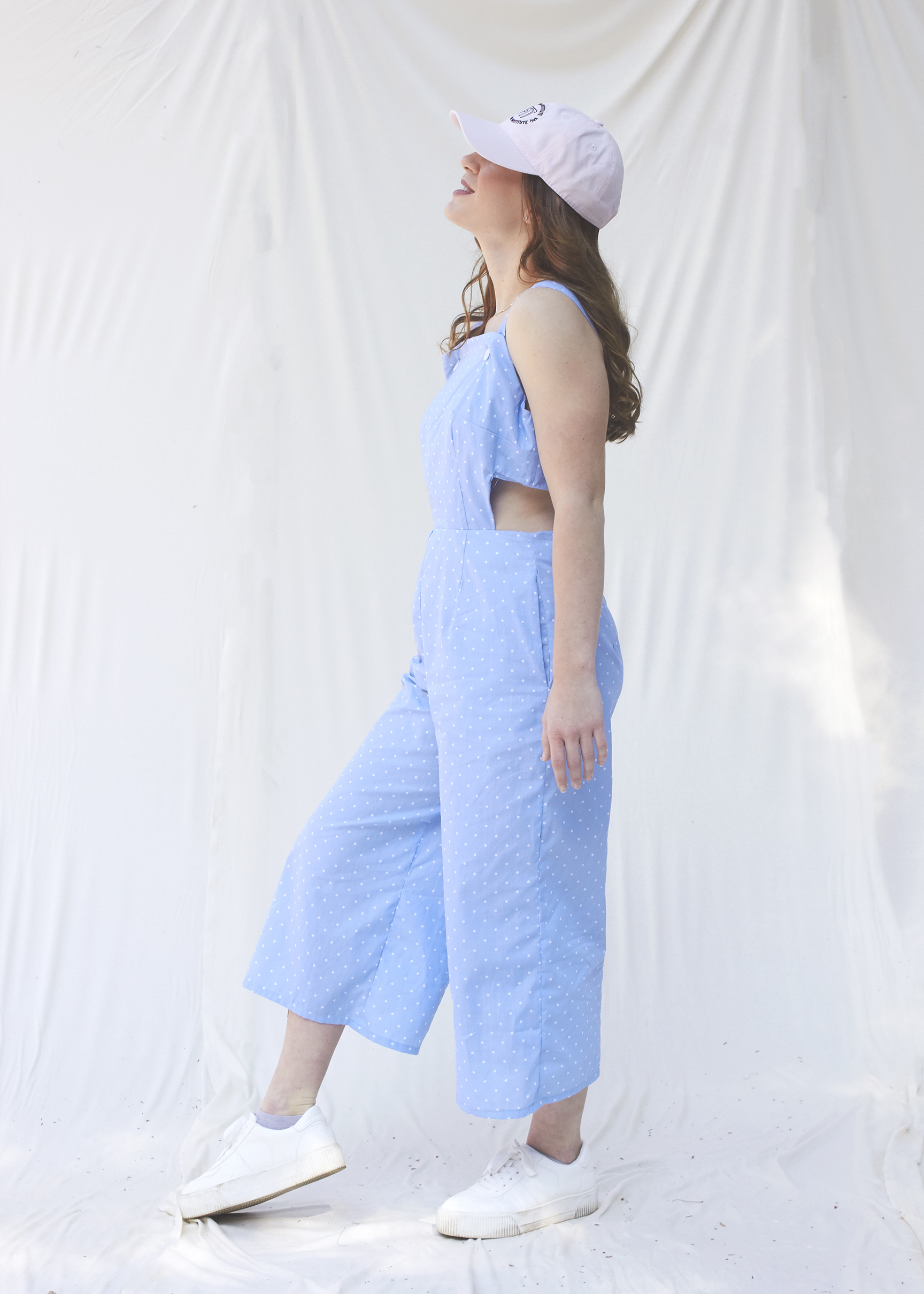 Light blue jumpsuit with cut out sides.