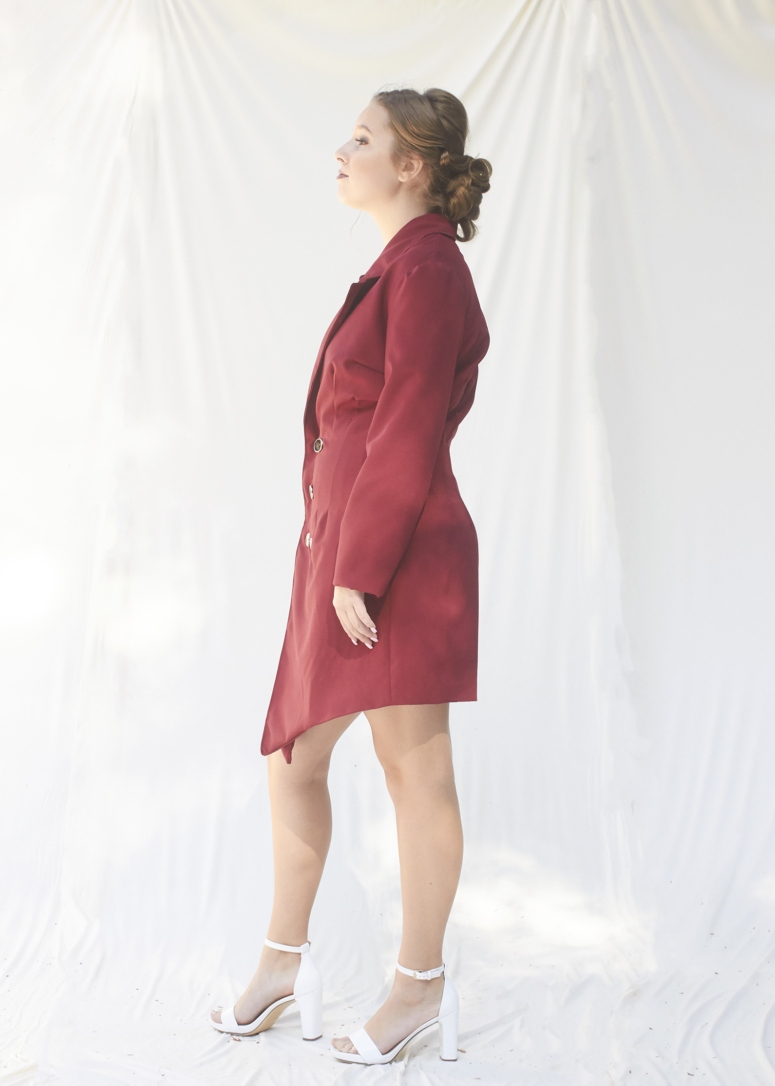 Side view of burgundy suit dress