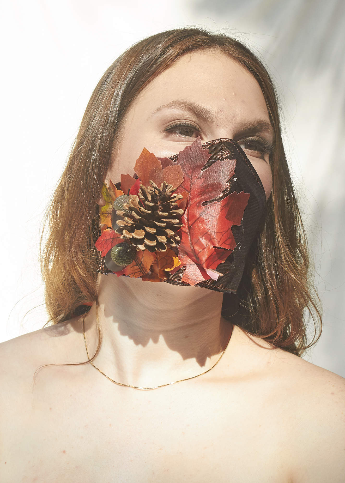 Girl posing in brown/red face mask