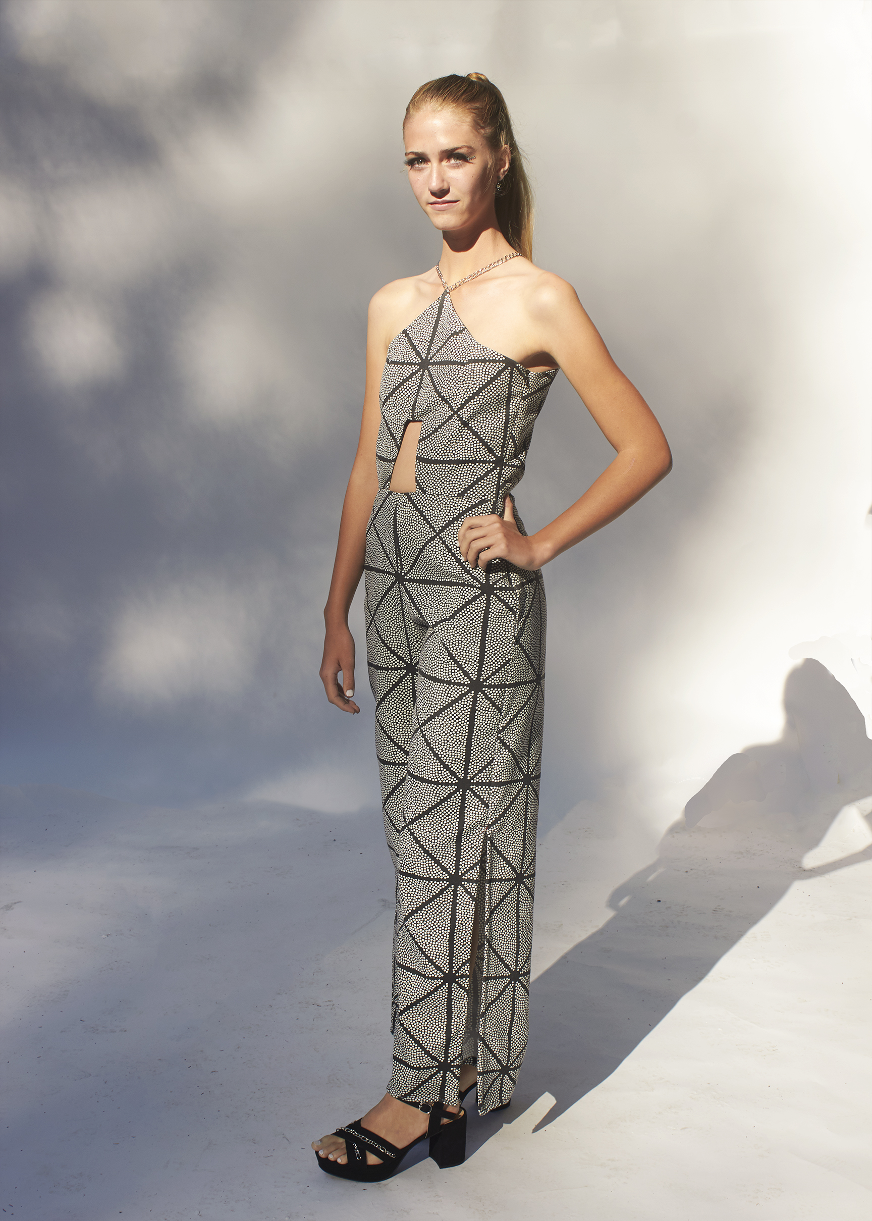 Photo of geometric cut out black and gray jumpsuit