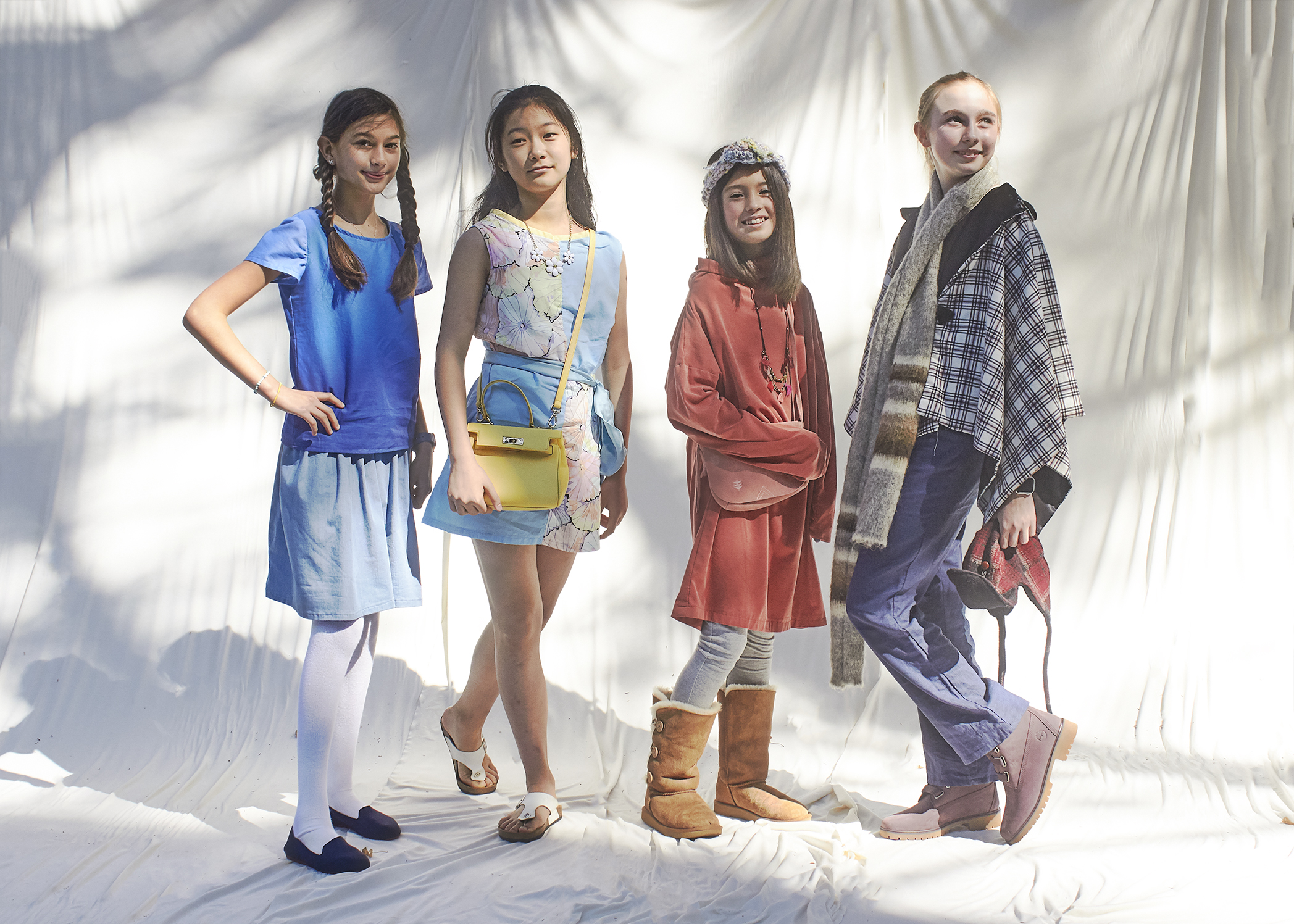 Four girls standing in a homemade sewn outfits showing the four season, spring, summer, autumn, and winter.