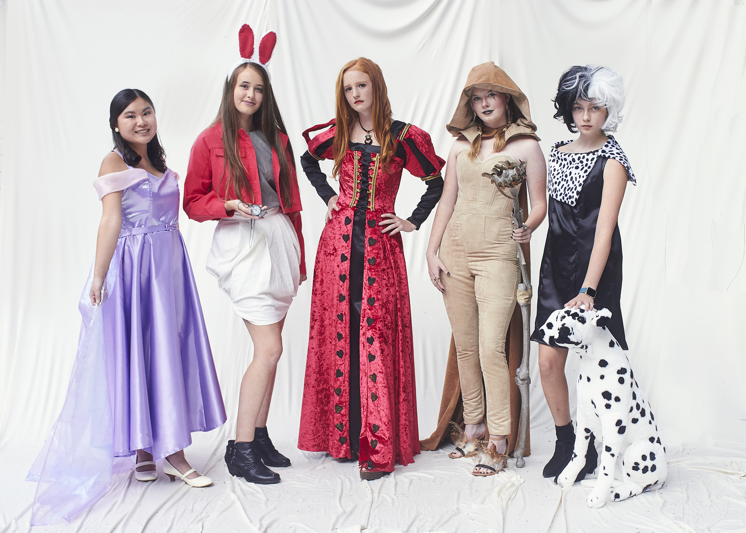 Group shot of girls in Disney costume. (From left to right there is Rapunzel, White Rabbit, Queen of Hearts, Scar, and Cruella Deville)